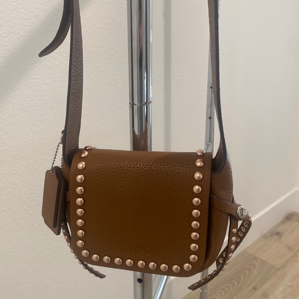 Coach brown leather with rose gold studs cross over bag